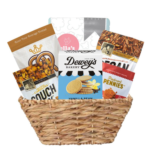 Large woven basket full of locally made NC gourmet snacks including savory and sweet options for Tar Heels 