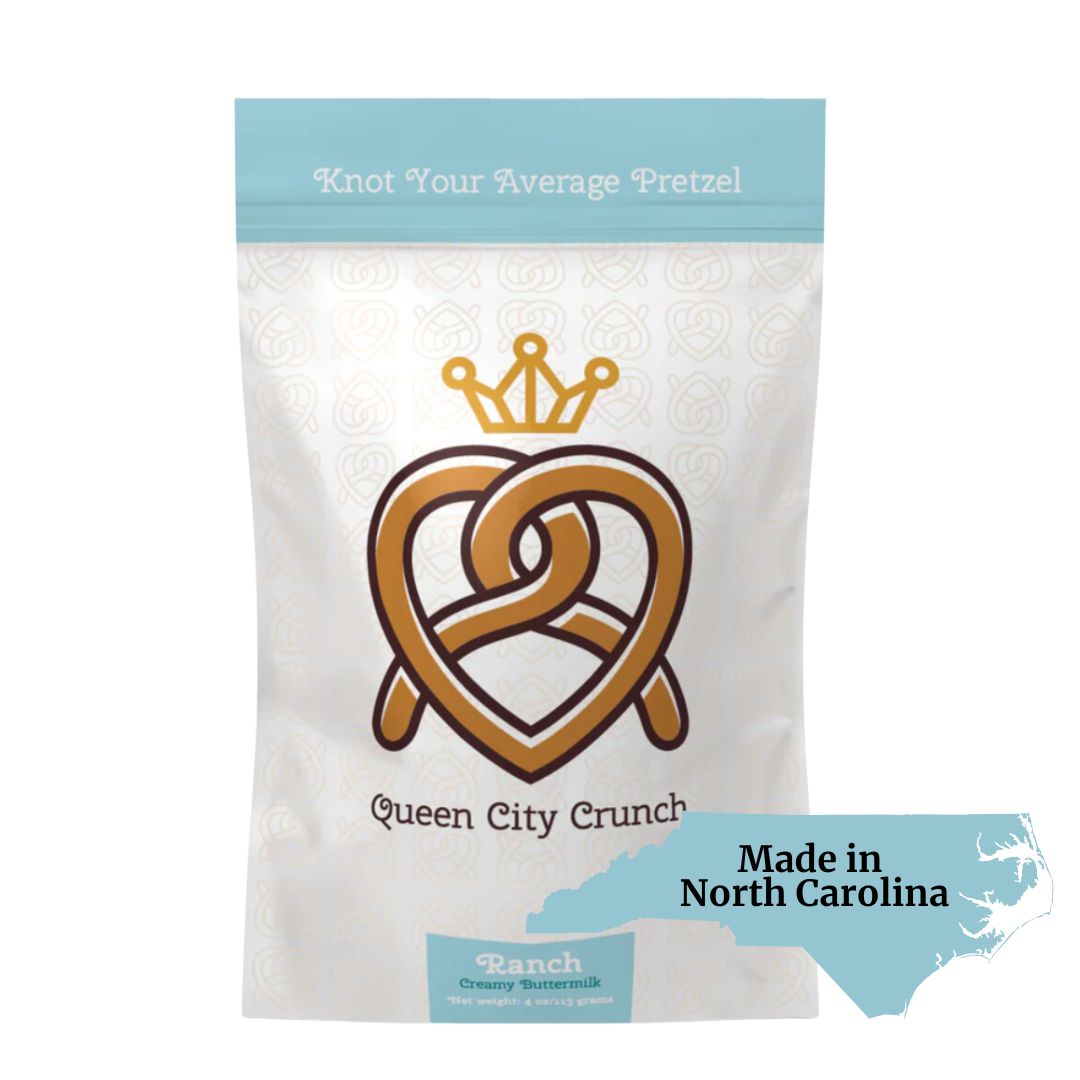 Queen City Crunch ranch pretzels in Carolina blue packaging, included in gift basket of locally made foods from North Carolina