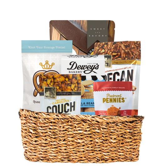 Large woven basket full of locally made NC gourmet snacks including savory and sweet options for Tar Heels 