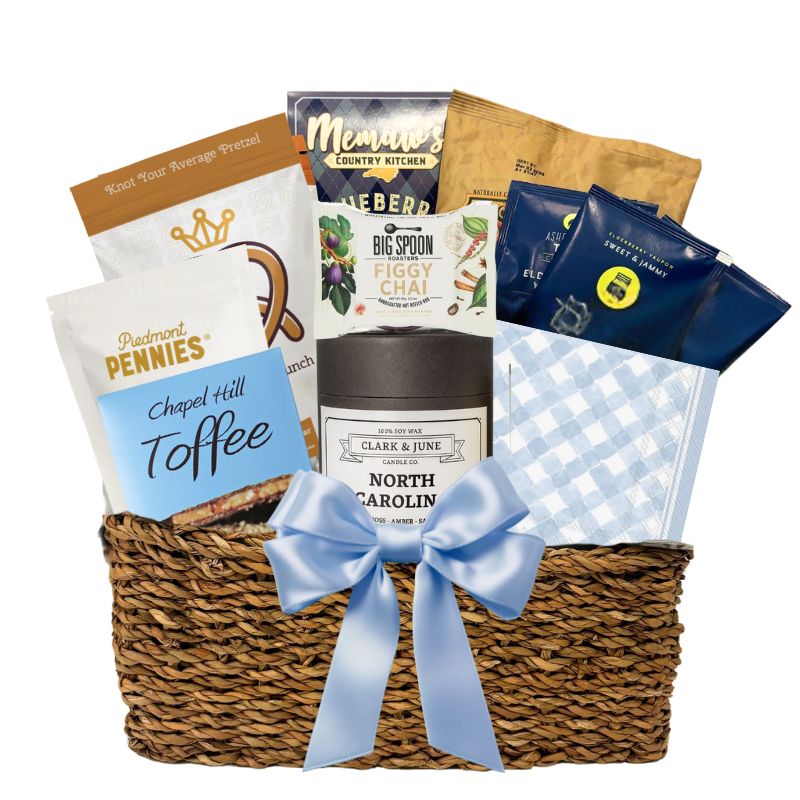 Gourmet Gift basket featuring a candle with the golf North Carolina silhouette and a variety of other made in North Carolina Gourmet foods.