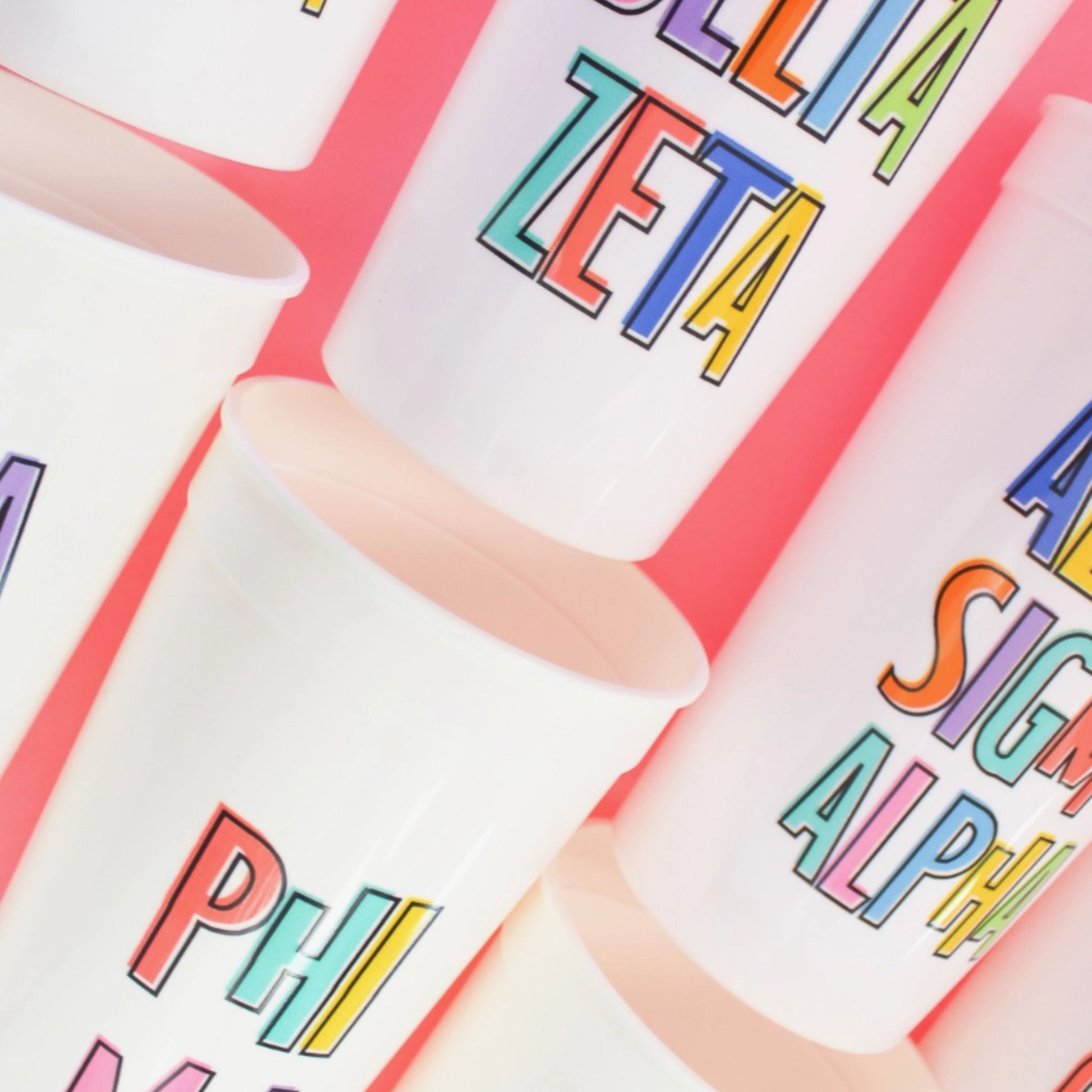 Group of 32 oz. Bring On The Fun Sorority Stadium Cups, showcasing various Greek symbols and designs, perfect for sorority gatherings and events.