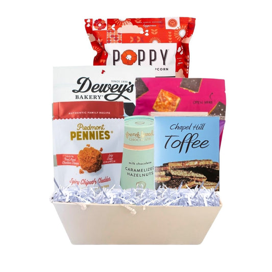 gourmet gift basket full of NC made products. including POppy popcorn, Legally addictive cookies, French broad hazelnuts, sweethearts conversation hearts, deweys cookies