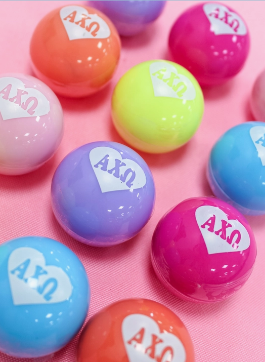 Alpha Chi Omega lip balm in a variety of colors.