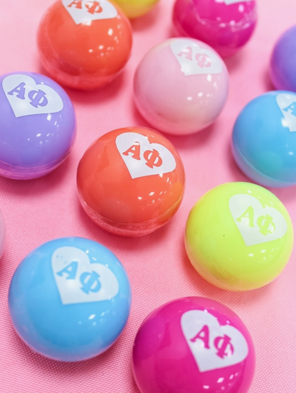 Alpha Phi lip balms in many different vibrant colors.