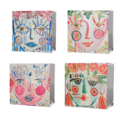 Four FANCY SISTER acrylic boxes with custom colors and gold highlights, featuring a watercolor face design.