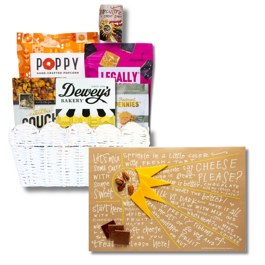 Sunburst Charcuterie Gift Basket with open charcuterie cheat sheet showcasing NC-made gourmet treats including popcorn, cookies, and cheese wafers.