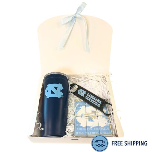 Tar heel graduation gift containing travel tumbler with UNC logo, Tar Heel bottle opener, and UNC branded chocolate