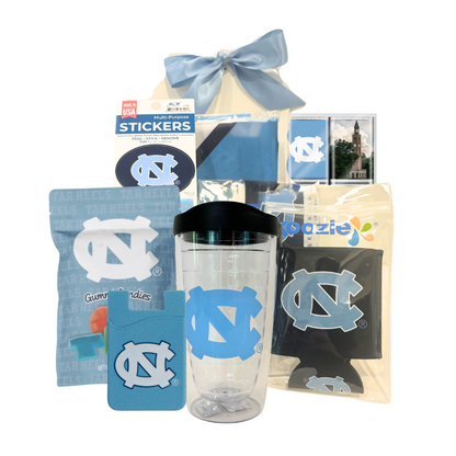 Welcome to UNC Gift Box featuring UNC-branded items including a flag, tumbler, chocolate, stickers, and more, perfect for celebrating new students at UNC Chapel Hill.