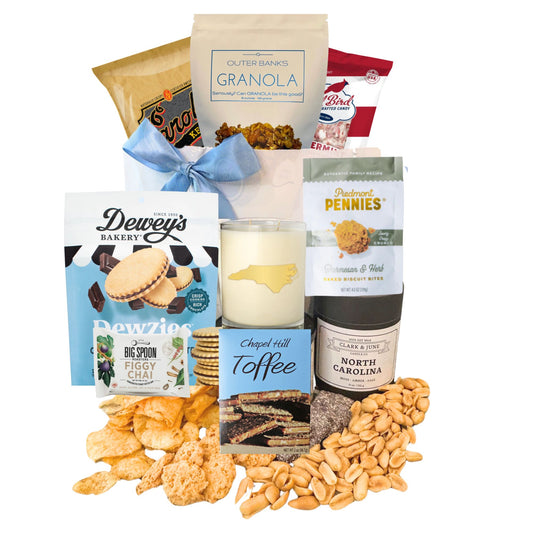 local north carolina food products displayed with gift bag and blue satin ribbon