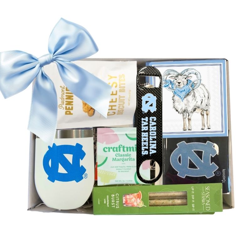 Carolina Celebration Gift Kit featuring a UNC  Tumbler with Lid, UNC Ram Beverage Napkins, and an officially licensed UNC Bottle Opener, all neatly packaged